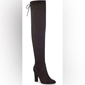 Above knee black suede boots.